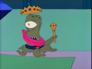 Kang wearing a crown in "Treehouse of Horror II," which cements his masculinity