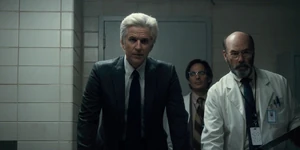 Brenner and his scientists watching Eleven use her powers to crush a Coca-Cola can.