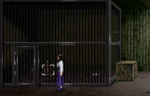 Simon locked up in a cage in the shed.