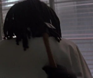 Adriana hitting Georgina with a hammer.