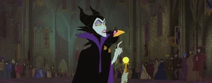 "But.."-Maleficent's tone of voice changes before she gives the baby princess a gift.