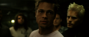 Tyler speaking with the other members of Fight Club.