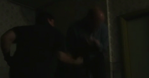 Phil is caught off guard as Dan takes the opportunity of the former's distraction to fight back (2001).