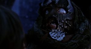 Van Helsing smashes the Dwerger's mask revealing its glossy eyes and piranha pointy teeth.