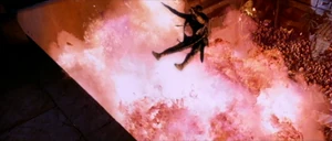 Memnon shot with an arrow and plummets from his balcony into a fiery explosion.