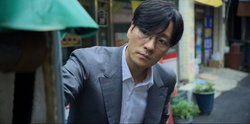 Sang-woo watches his mother