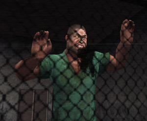 Inmate banging his head against a window.