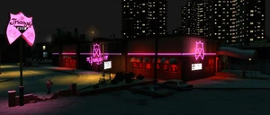 The Triangle Club at night.