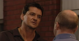 Phil watches as Dan vows revenge against him (2000).