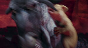 Ryan leaps onto Kazar's back.