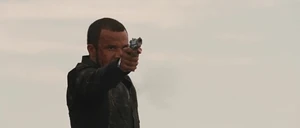 Zizi prepares to kill Dom following a high-speed car chase between them.