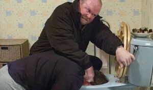 Phil dunks Ian in the toilet while breaking into his house (2005)