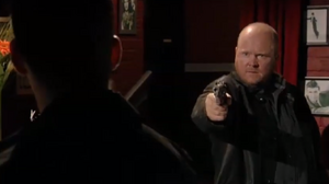 Phil confronts Dennis at gunpoint as he prepares to kill him under Dalton's orders.