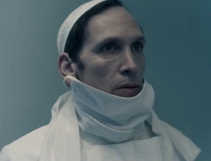 Putnam in a hospital outfit.