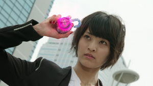 Yoko about to transform into Kamen Rider Marika.