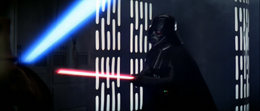 Vader attacked once more and began to push Kenobi towards a wall.