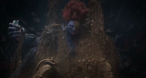 Lord Redmane holding a rock
