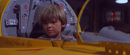 When the group entered the Theed hangar bay, Skywalker heeded Jinn's command for him to stay hidden in the cockpit of one of the hangar's N-1 starfighters.