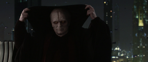 Sidious raises the cowl of his robe to hide his scarred features.