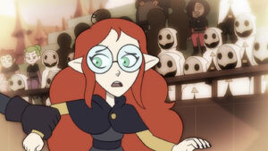 Lilith getting her arm grabbed by the Coven Scouts.