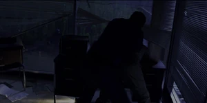 Grigori pinning Hopper down.