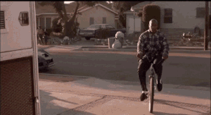Deebo riding a bike he stole.