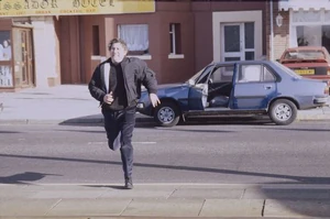 Alan chasing Rita in Blackpool after she escapes from his grip.
