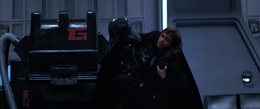 Luke carries Anakin through the hangar of the second Death Star.