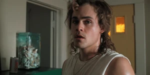 Billy watching Max walk away back to her room.