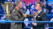 Greg Hamilton being bullied by Shane McMahon for announcing his "Best In The World" announcement incorrectly