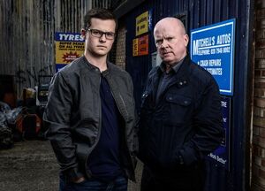 Phil Mitchell with his son Ben (played by Harry Reid) in 2014.