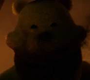Fredbear smiling before biting the child