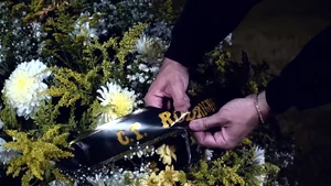 The Invader cutting Rodrigues' name in his grave