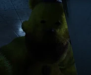 Fredbear grabbing the worker