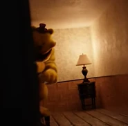 Fredbear peeking from the corner of a hallway