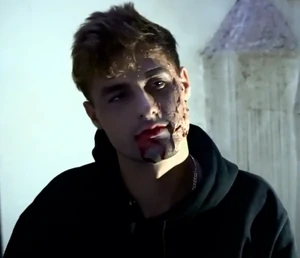 An unmasked Invader after being punched in the face by Cadet Rodrigues (It's not Rezende, but his twin brother)