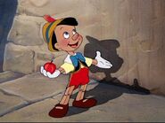 Pinocchio (Puppet boy, adopted son of Geppetto, captured by Frollo in the earlier events, freed by Robin Hood and Peter Pan's rescue team, captured once again by the Coachman and allies, escaped in the aftermath of the circus audience, granted donkey ears, journeyed through the seas to find Monstro and Geppetto at the behest of the Blue Fairy, swallowed by Monstro, managed to escape through a ruse, joined Hercules and Aladdin's resistance force as moral support, threatened by the Titans, contributed his effort in stopping Maleficent and Chernabog in battle of Bald Mountain, survived and re-joined with his father at the end, remained at his father's workshop along with his family)