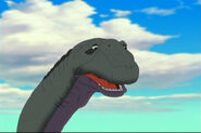 Grandpa Longneck (Caring Sauropod, co-leader and intellectual of the grown up dinosaurs, grandparent of Littlefoot, ally of of Tarzan and Simba's combined alliance, prominent combatant of the main resistance force, wounded by Clayton in battle against Grimhilde's forces, threatened Hades in battle with the Hydra, contributed his effort in stopping Mok, Maleficent, Chernabog, and their allies in battle of Bald Mountain, celebrated the end of the war at Pride Rock along with the rest of the grown up dinosaurs, departed with his family to a better place)