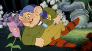 Stanley (Benevolent troll-creature, flower craftsman, captured by Frollo, casted out of Paris by Gaston along with Gurgi, joined forces with Snow White and Peter Dickison, later with the main resistance force, hypnotized Willie The Giant with his flowers, transformed Maleficent's goons' arrows into harmless flowers, turned into a stone statue by Dr. Facilier's magic in battle of Bald Mountain, freed by the Fairy Godmother's magic wand, departed to the unknown)