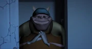 Uncle Samsonite smiling widely% 2C and weirdly.