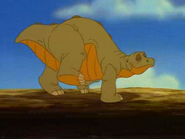 Spike (The Land Before Time) (Gluttonous Stegosaurus, foster brother of Ducky, adopted son of Mama Swimmer, close friend of Littlefoot, chief asset of Littlefoot's group, prominent fighter of Simba's inner circle, and later of the main resistance force, clashed with McLeach and allies, Scar and allies, the Hydra, and many others, contributed his effort in stopping Mok, Maleficent, and Chernabog in battle of Bald Mountain, celebrated the end of the war at Pride Rock along with Littlefoot, friends and allies, bid farewell to Simba and allies before departing to a better place)