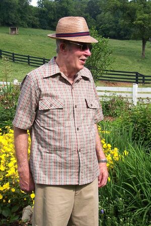 Semi-fitted shirt with pointed collar less the cuffs and shoulder epaulets