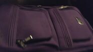 A mom's purple suitcase