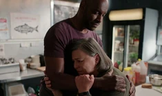 Connie and Preacher hug. Connie looks distraught.