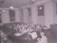Randallthompson 2157649.jpg (142 KB) Thompson at piano for Glee Club rehearsal