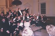 Butterman conducting the Glee Club in "The Twelve Days of Christmas"