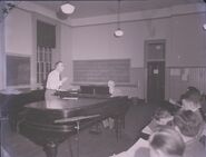Randallthompson 2157669 1.jpg (131 KB) Tuttle conducting Glee Club rehearsal with Thompson accompanying