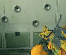 Four bullet holes in metal, and the laser welder.