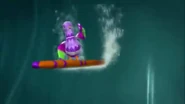 Pecky Pudegon riding a surfboard catching a water wave.