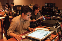 Okuda Yasuji and Hachioji-P during the song's mixing